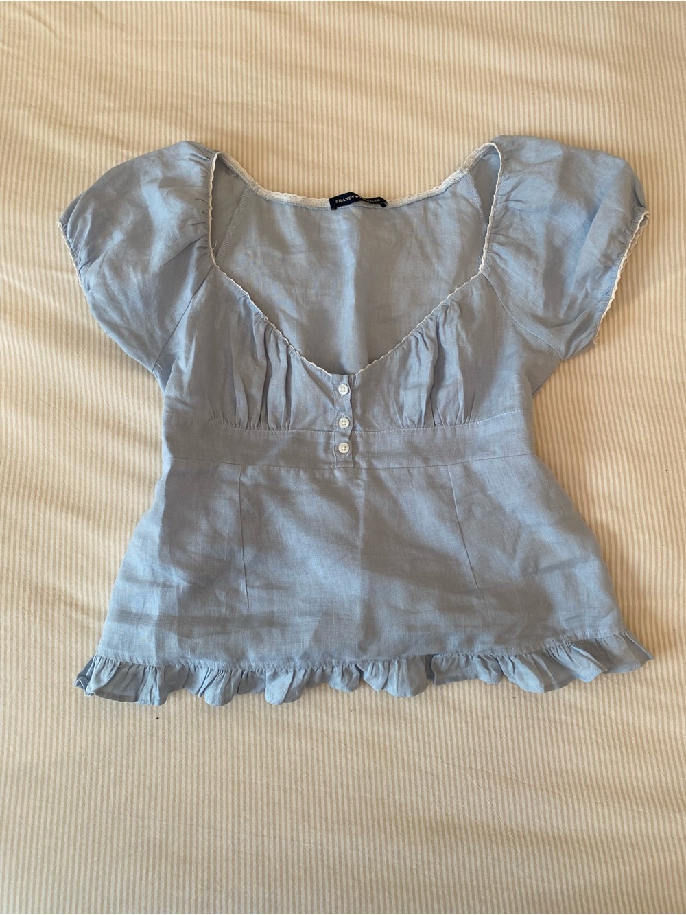 Brandy Melville light blue cotton babydoll top with ruffles and buttons
